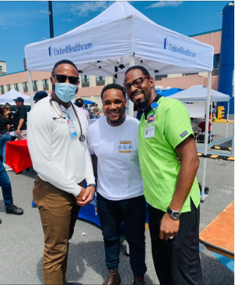 Three gentlemen smiling